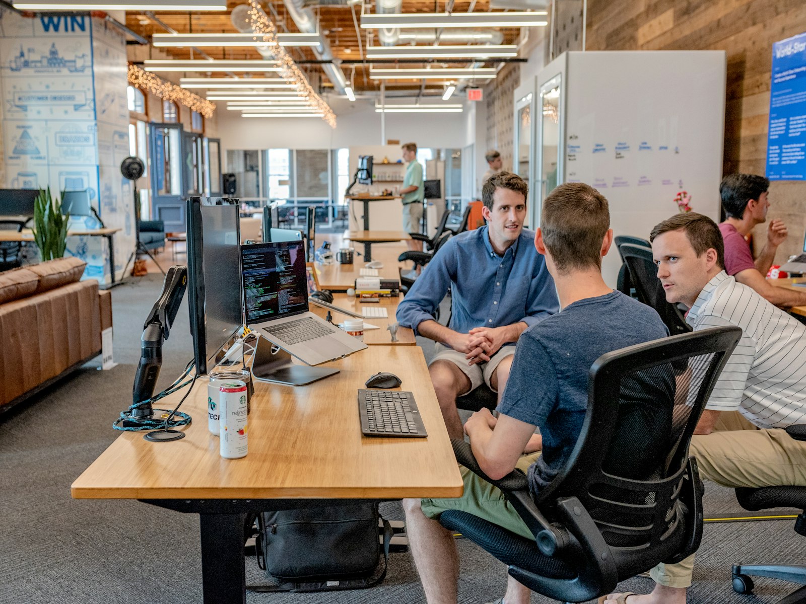 A team discussing AI agent use cases around a desk